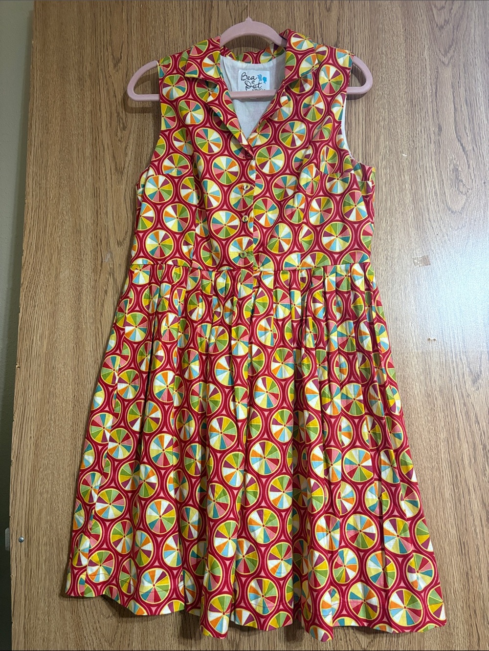 Bea & Dot Red Sleeveless Fit-and-Flare woman’s Dress with Multicolor Wheel Print